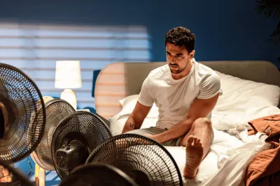 Man sweating at night by sleeping hot